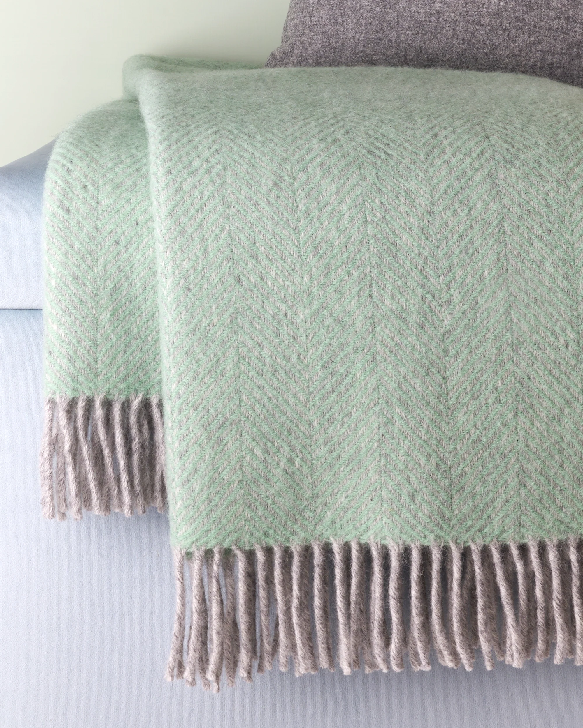 grab laurel green silver grey herringbone wool throw cushy home and style copyright