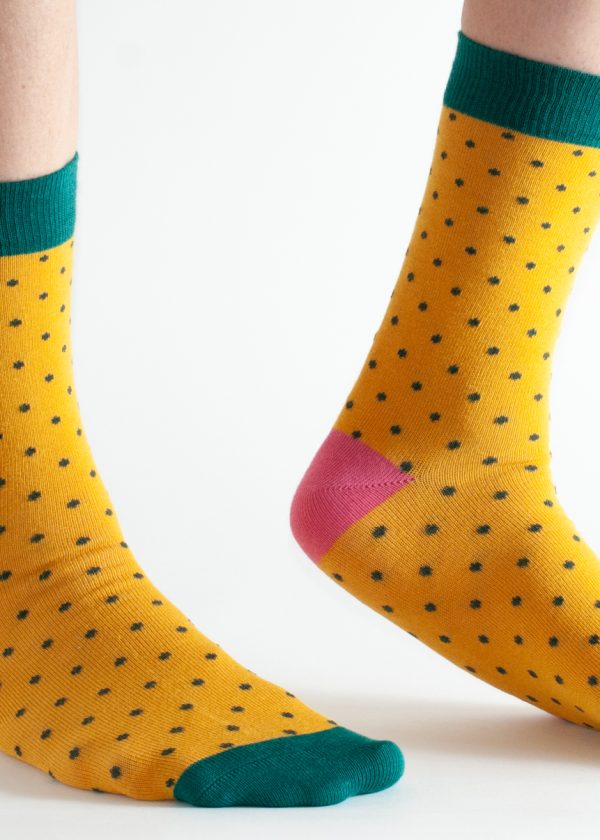 Bamboo socks, main colour yellow with black spots, with pink heel cup, and green toes and ankle cuff