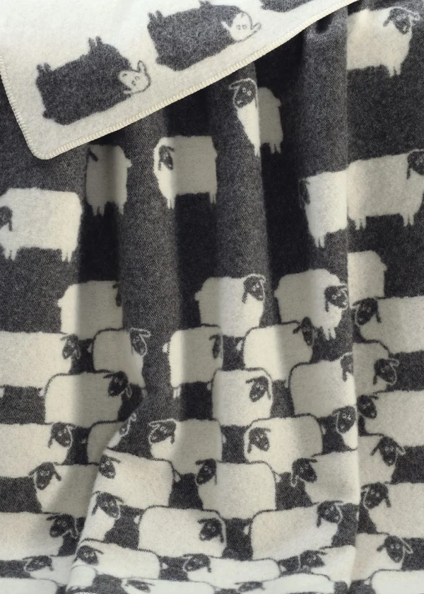 monochrome herd of sheep wool throw